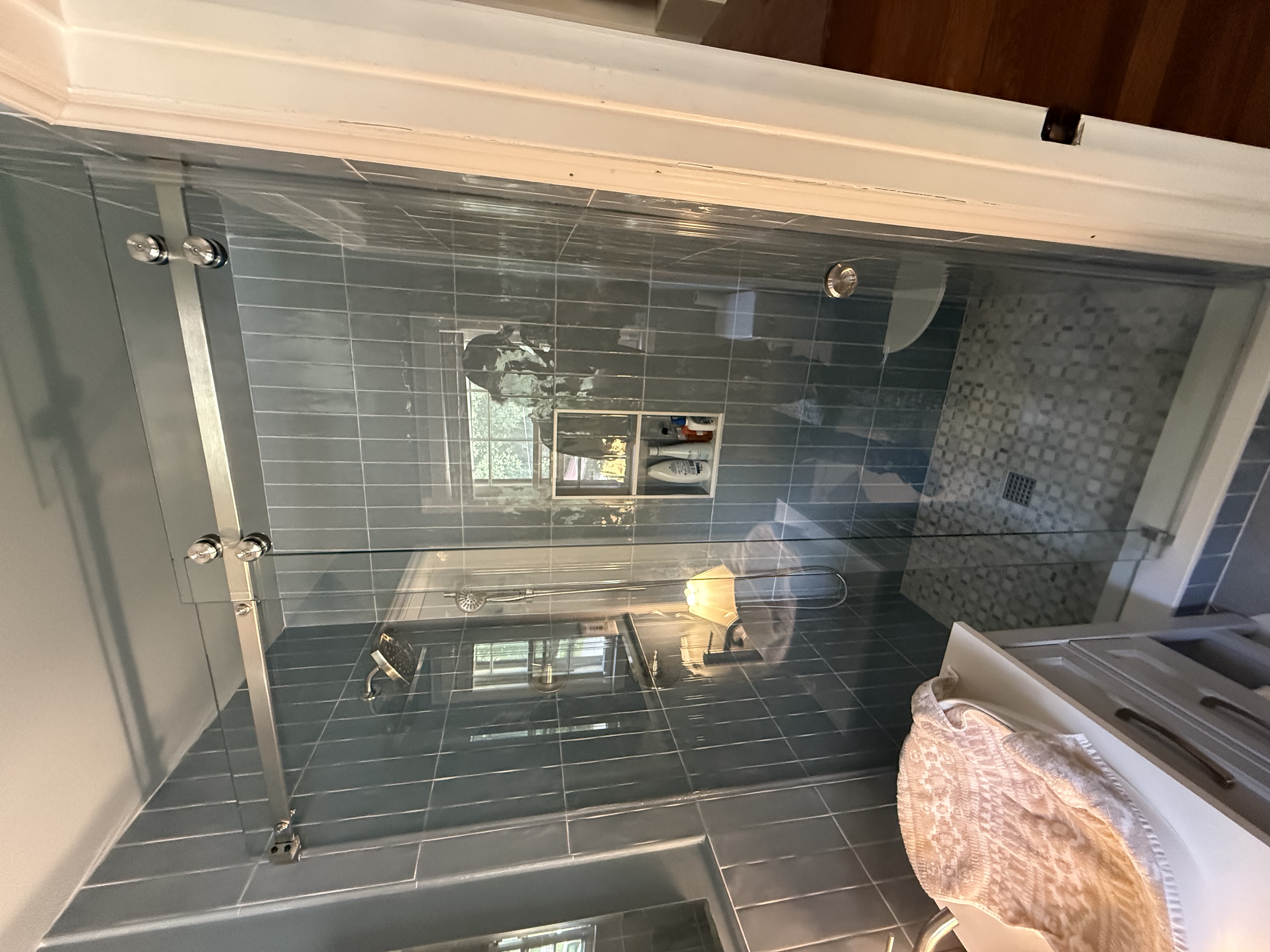 An amazing single sliding door with a brushed nickel finish.